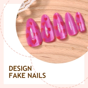 Pink cat eye fake nails with red heart patterns in long almond shape for Valentine