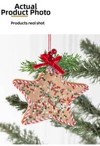 Detailed close-up of a felt star Christmas ornament with beads and red velvet bow