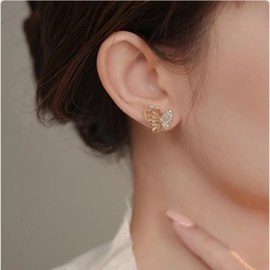 Elegant butterfly stud earrings with asymmetric gold hollow design and sparkling zircons