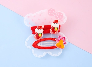 Detail of Christmas kids hair accessories set with Santa socks and bell bows on card
