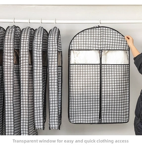 Detail view of garment cover with houndstooth pattern and transparent view window
