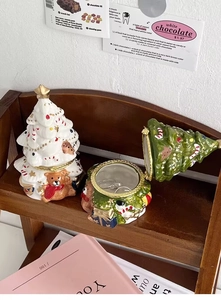 Detail of Christmas tree ceramic jewelry boxes with teddy bear and Santa Claus decorations