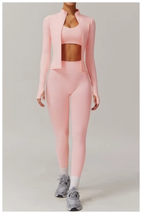Detailed view of pink yoga set featuring zip jacket with thumbholes and high-waist leggings