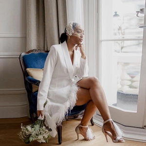 White V-neck blazer dress with feather trim and long sleeves for formal party wear
