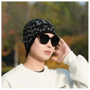 Detail of men's winter knit beanie with thermal fleece lining and stylish pattern