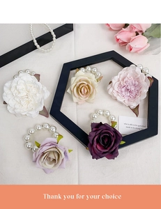Detail showing five colors of silk flower bracelets with artificial pearl wristbands