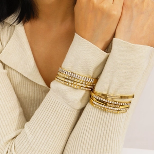 Chic gold-plated stainless steel bangles set with sparkling zircon stones on model