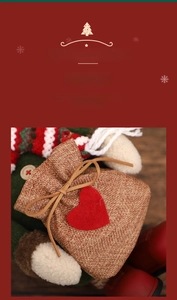 Detail of burlap Christmas gift bag with red felt heart and festive drawstring texture