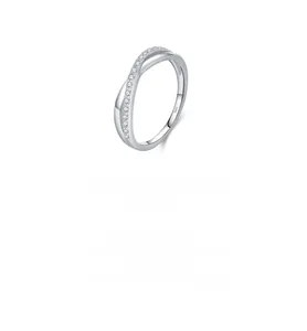 Detail of S925 sterling silver ring featuring a crisscross spiral design with cubic zirconia