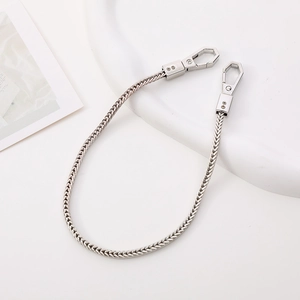 Detailed view of silver braided metal phone chain featuring secure spring clasps on both ends