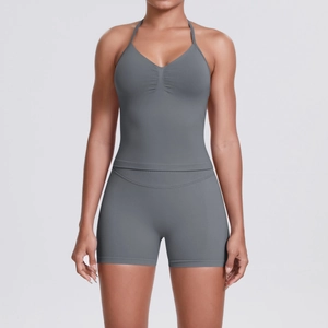 Front view of grey seamless yoga set with halter neck top and high-waist sports shorts