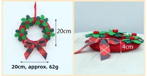 Detail of a 20cm Christmas wreath featuring red holly berries and plaid bow decoration