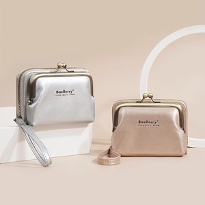 Detail of lychee textured PU leather coin purses with metallic kiss-lock and wristlet