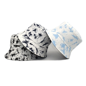 Stylish tie-dye canvas bucket hats in various patterns for outdoor sun protection