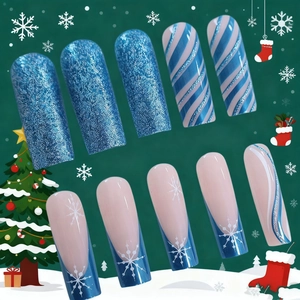 Classic French long press-on nails with blue glitter and festive snowflake patterns