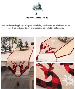 Detail of Christmas table runner with reindeer embroidery and white pearl snowflake accents