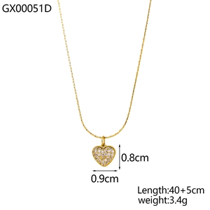 Macro shot of a 18k gold plated heart pendant with sparkling clear cubic zirconia stones