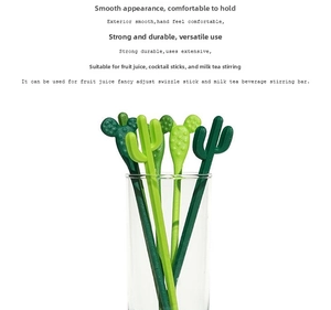 Green cactus-shaped stirring rods for coffee and cocktails in close-up detail