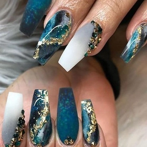 Long ballet style press-on nails with blue gradient design, gold foil, and rhinestone decor