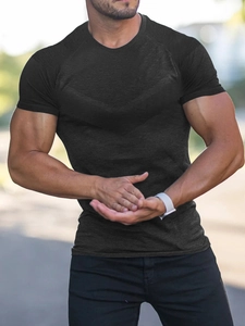 Close-up of black men's compression shirt showing textured moisture-wicking fabric