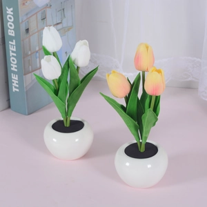 Solar LED tulip flower lights in white and pink ceramic pots for cozy bedroom decoration
