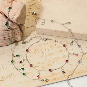 Silver belly chains with colorful zircon waterdrop charms and lobster clasp on stone