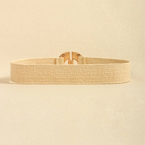 Detail of beige elastic straw belt featuring an elegant gold alloy buckle closure