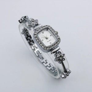 Elegant silver square quartz watch with rhinestone floral bracelet and white dial