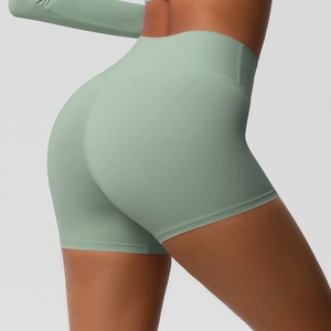 Detail of high waist sage green yoga shorts with V-shaped back seam for butt lifting effect