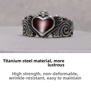 Gothic titanium steel ring featuring a red and black heart with ornate scroll engravings