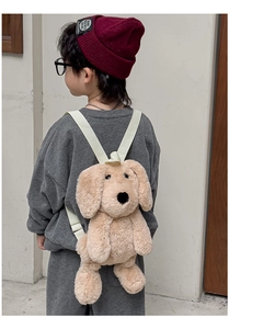 Rear view of a child wearing a cute beige puppy plush backpack with adjustable straps