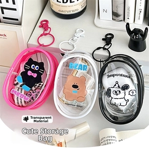 Detailed view of three cute cartoon PVC pouches in pink, white, and black with hooks
