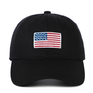 Black cotton baseball cap with embroidered American flag patch on a white background