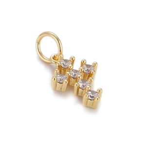 Detailed close-up of a gold-plated hip-hop cross pendant with clear inlaid crystals