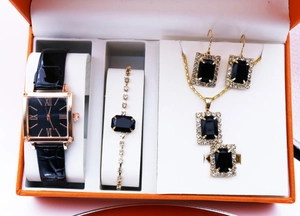 Luxe gift set featuring rectangular black quartz watch and emerald-cut black gemstone jewelry