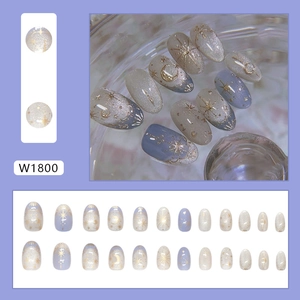Star and moon press-on nails with blue gradient and gold celestial motifs, 24 pieces