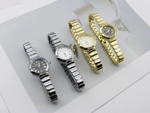 Detail of luxury women's watches with Roman dials, diamond bezels and metal straps