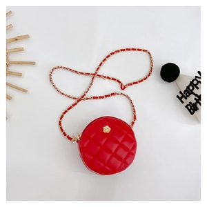 Detail of red quilted round mini bag with gold flower clasp and chain strap