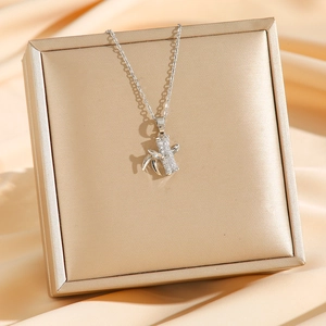 Silver titanium steel bamboo pendant necklace with micro-paved zircons on jewelry box