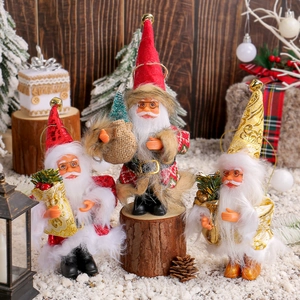 Three Santa Claus dolls in red and gold outfits displayed on a festive snowy wood background
