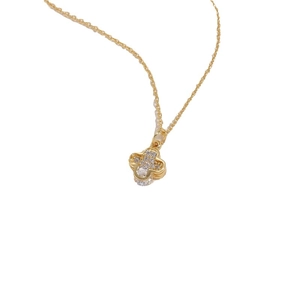 Gold necklace with clover pendant featuring sparkling zircon crystals on white background