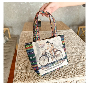 Detailed close-up of ethnic style canvas tote bag featuring Penang Street Art embroidery