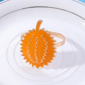Creative orange durian metal napkin ring on a white plate for elegant table settings