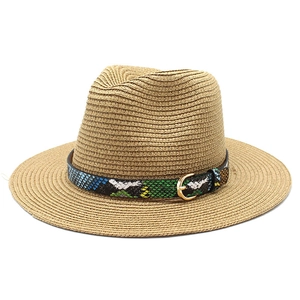 Detailed view of the woven straw fedora featuring a stylish snake-patterned leather band