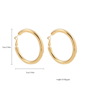 Detail shot of 5cm polished 18K gold-plated chunky hoop earrings on white background