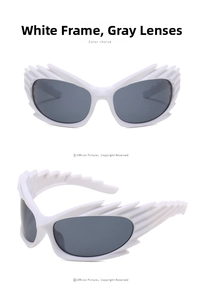 Detail of white bat-wing frame sunglasses with grey lenses and avant-garde flame design