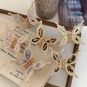 Elegant rhinestone butterfly claw clip set in various colors with a gold alloy frame