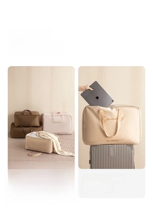 Detail of durable satin storage bags for quilts and clothes shown with a travel suitcase