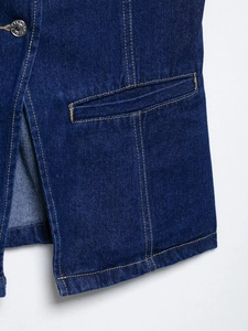 Detail of dark blue denim vest with contrast yellow stitching and metal buttons