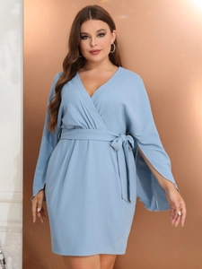 Elegant plus size light blue wrap dress with split sleeves and a waist belt